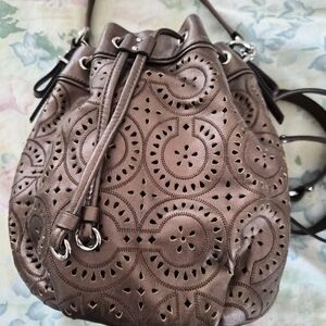 Coach Copper Metallic Leather Drawstring Crossbody Bag Laser Cut Lace Design